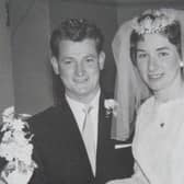 Bill and Mary cutting their wedding cake in January 1963