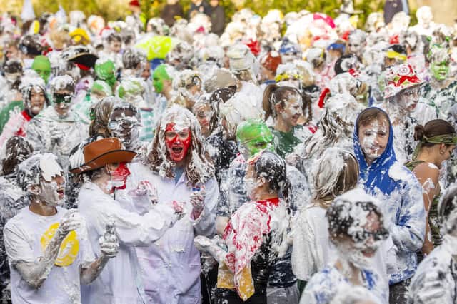 Students at St Andrews University take part in the annual Raisin Monday foam fight on St Salvador's Lower College Lawn.