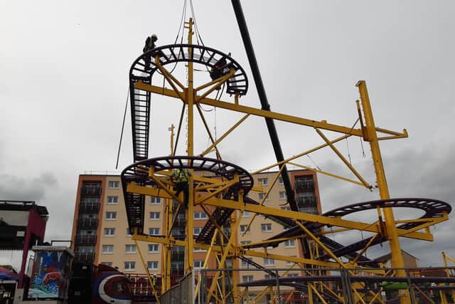 Work has started setting up the rides on the Esplanade for the 2023 Links Market (Pic: Fife Free Press)