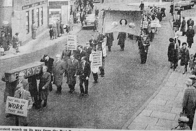 Workers from Kirkcaldy linoleum factory Barry, Ostlere & Shepherd march through town after 750 jobs were lost in cuts. They carried a coffin made of linoleum to signify the company's demise