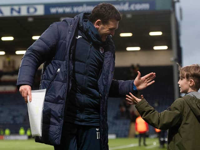 Raith boss Ian Murray celebrates with young fan after Saturday's victory over Motherwell (Pic Craig Foy/SNS Group)