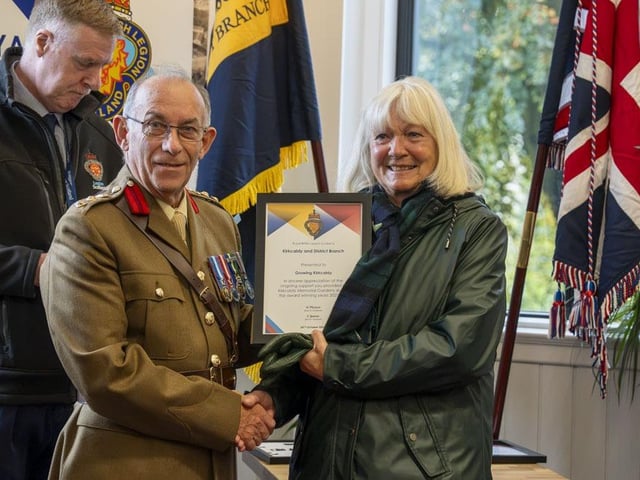 A presentation to Growing Kirkcaldy, represented by Alice Soper, by Colonel Jim Kinloch to thank the group for all the work it does in the War Memorial gardens