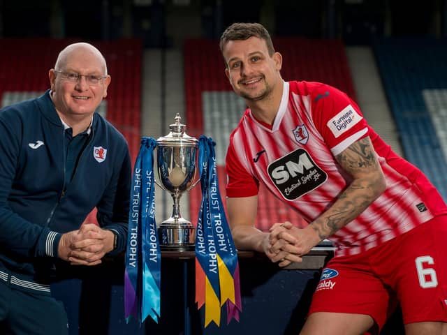 John McGlynn and Kyle Benedictus with the SPFL Trust Trophy. (Pic: Craig Watson)