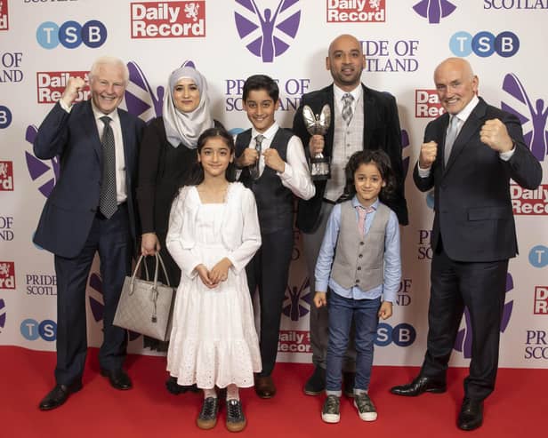 Outstanding Bravery award winner Asif Iqbal with his family and presenters Barry McGuigan MBE and Jim Watt MBE.  (Pic: Alasdair MacLeod)
