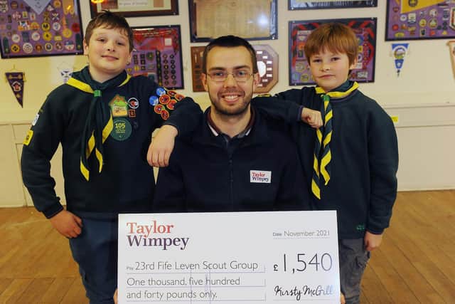 Craig Christie, Buyer for Taylor Wimpey East Scotland and volunteer for 23rd Fife Leven Scout group with cubs and leaders of the group.