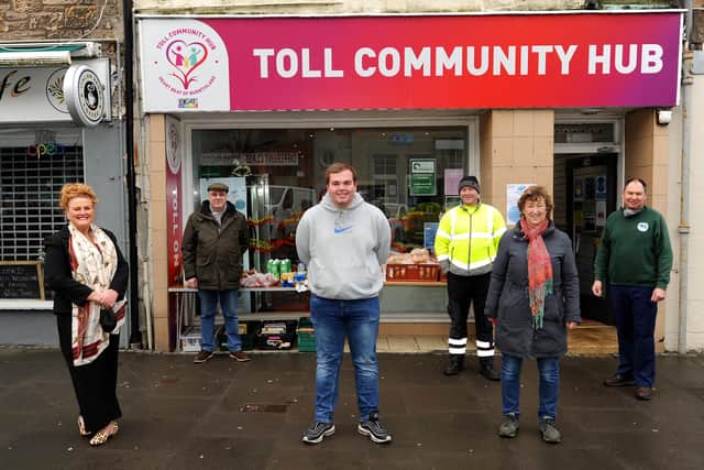Yvonne Crombie (left) with Brendan Burns and some of the BEAT volunteers who have been given the Burntisland community award for helping the community during the pandemic. They are pictured outside the Toll Community Hub on the High Street. Pic:  Fife Photo Agency.