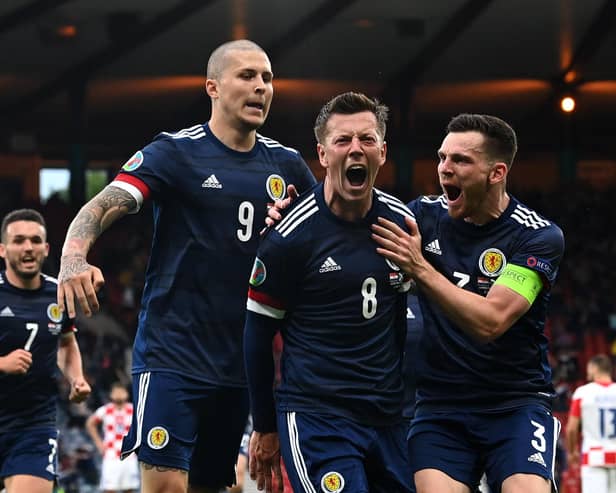 Scotland players mob Callum McGregor after his goal against Croatia (Pic by Paul Ellis/Getty Images)