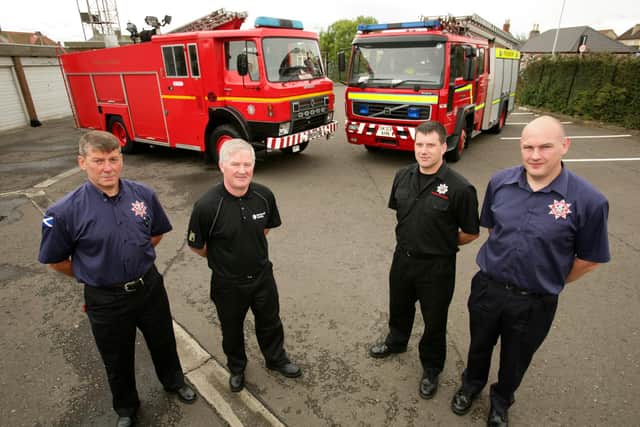 A restored fire engine set to leave for South America through the work of IFRA in 2009.  From left, Billy Blyth (International Fire & Rescue Association), Gordon Sutherland (Barloworld) Davy Kay (Fife Fire & Rescue) and Iain Brown (IFRA).   Picture: Walter Neilson.