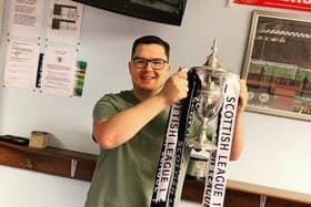 Martin holding the Scottish League One cup after Raith Rovers won it three years ago.