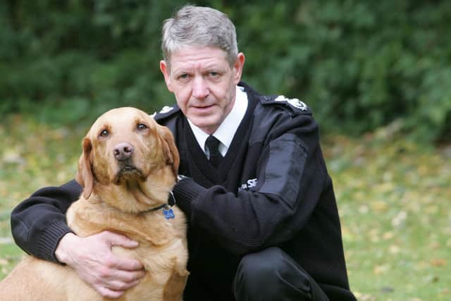 Scottish SPCA Chief Superintendent Mike Flynn with Monty the Golden Labrador. Pic: Peter Devlin