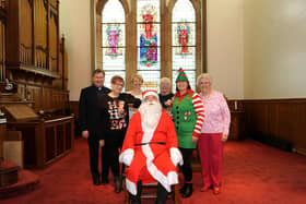 Santa (Jim Taylor) & his little helpers, visit minister Andrew Donald to promote Pathhead Church's 60th Christmas Fair.  (Pic: Fife Photo Agency)