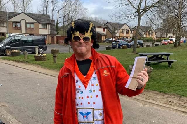 Postman David Barbour dressed up as Elvis on his rounds