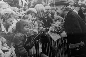 The Queen talks to people in the crowd during her visit to the Lang Toun in 1998.