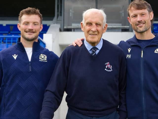 Scotland rugby legend Dave Rollo, centre, with fellow former Howe of Fife players George and Peter Horne in front of the stand at the Cupar club's Duffus Park ground now named after him (Photo: Scottish Rugby)