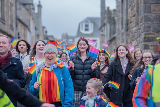 Hundreds of people took part wearing rainbow colours and waving rainbow flags.