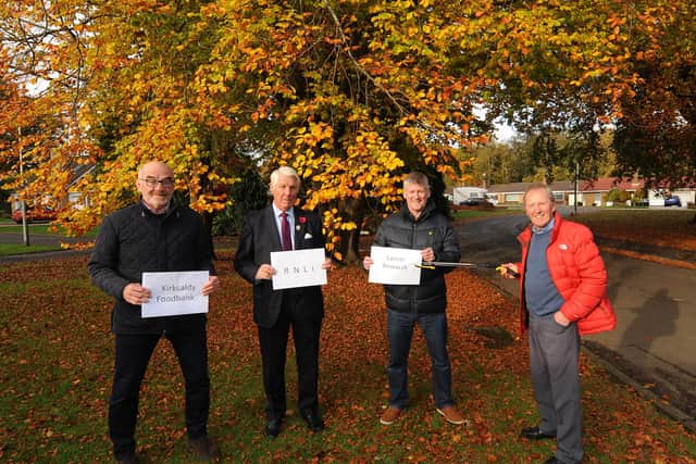 Ewan Fraser from Raith House Owners Association presenting funding to Ken Mowbray, committee member of Kirkcaldy Foodbank, Michael Baxendine, chairman of Kirkcaldy branch of the RNLI, and Gordon Reid, chairman of Cancer Research, Kirkcaldy branch. Pic: Fife Photo Agency.