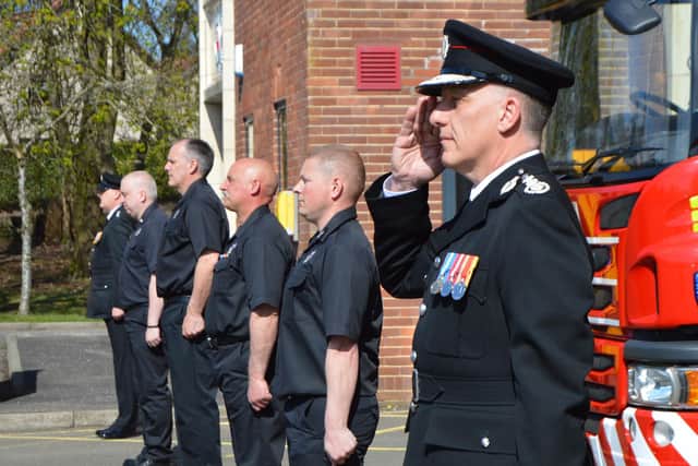SFRS Chief Officer Martin Blunden joined fire crews observing the national minute's silence