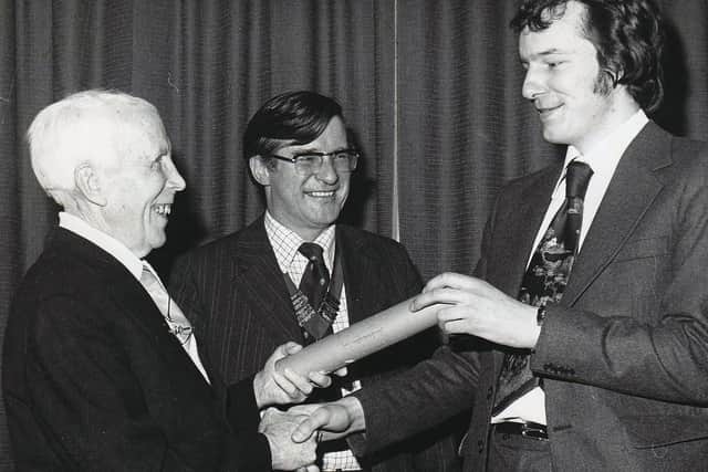 Tom Murray (left) presents Colin Simpson with the first award in 1978 while East Fife Mail editor Ian C. Paterson looks on.