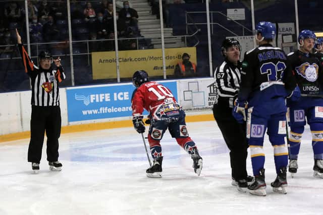 Defenceman Erik Naslund and Stars' forward Phillippe Sanche in the thick of the action (Pic: Steve Gunn)