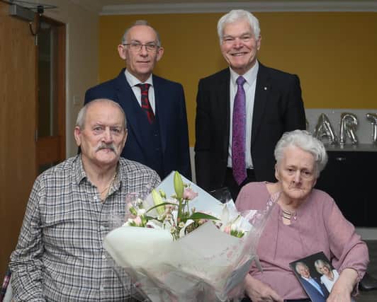 George and Ann Allison celebrated their diamond wedding anniversary.  Cllr Rod Cavanagh presented flowers on behalf of Fife Council, and Col Jim Kinloch, DL  represented the Fife Lieutenancy.  (Pic: Andrew Beveridge)
