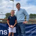 St Andrews Partner Alistair Lang presents Findlay Price, aged 10, with his award.