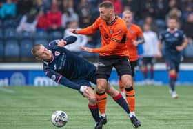 Liam Dick of Raith Rovers (left) is battling it out with Dundee United's Louis Moult (also pictured) for the Scottish Championship crown (Pic Sammy Turner/SNS Group)