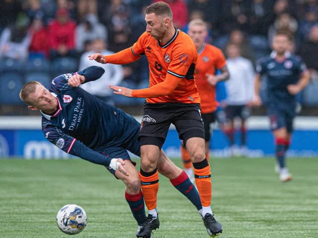 Liam Dick of Raith Rovers (left) is battling it out with Dundee United's Louis Moult (also pictured) for the Scottish Championship crown (Pic Sammy Turner/SNS Group)
