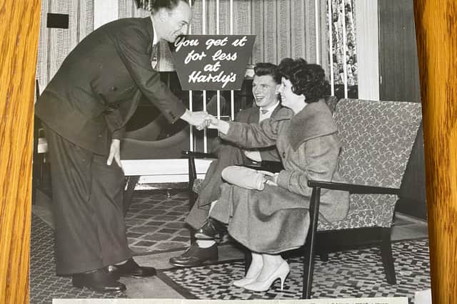 Peter and Nan, who was named Bride of the Month in the Fife Free Press, with their fireside chairs presented to them by Mr Marsh, manager of Hardy's Furniture Stores.