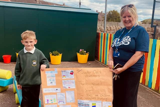 Rory Ritchie presented Jane Leslie of Pepsico Quaker with a collage of drawings and messages from the Springfied Primary pupils.