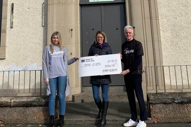 Jenny Gilruth presents he fundraising cheque to SAMH
