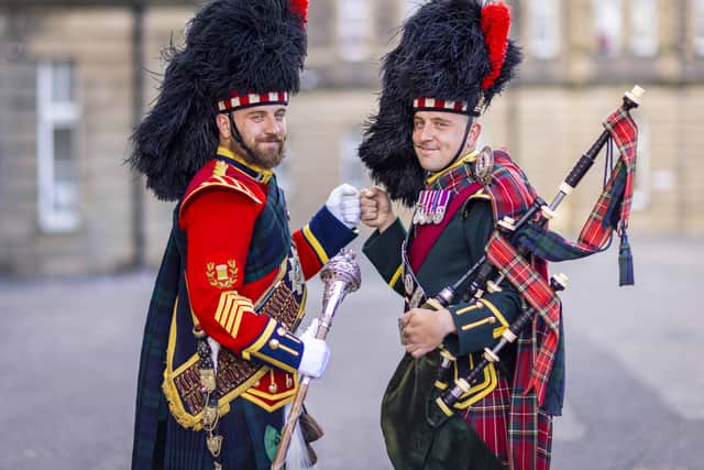Identical twins, Sergeants Peter and James Muir, lead as the Scots pipe and drum majors at the Royal Edinburgh Military Tattoo.  Pic: Corporal Nathan Tanuku.
