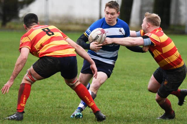 Iain Aitken, in possession, tries to make a breakthrough for Howe of Fife at Burnbrae (picture by Chris Reekie)