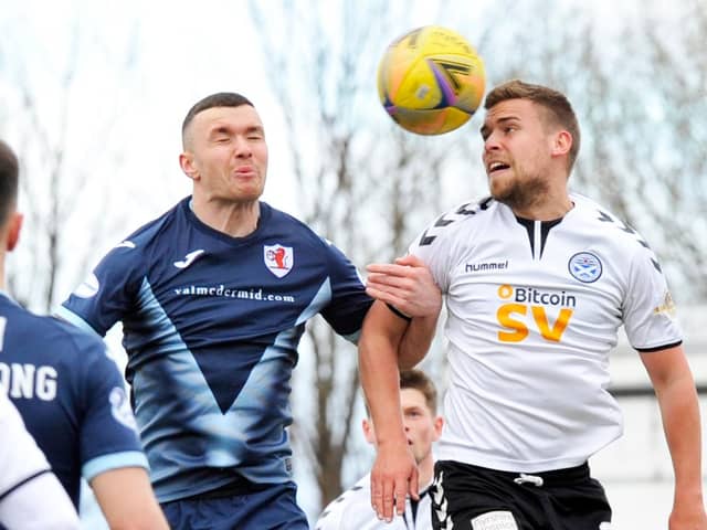 Ross Matthews challenges for the ball against Ayr (Pic: Charlie Gilmour)