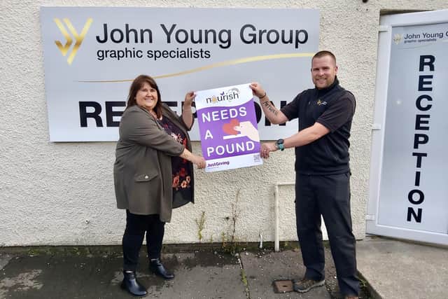 Lynne Scott with James Ewing at John Young Signs.