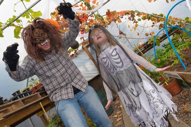 Wolf Man is Graeme Walla (Environmental Co-Ordinator for CLEAR) and wee girl is Honey Knights, from Glasgow, at the CLEAR Hallowe'en open day in 2014.