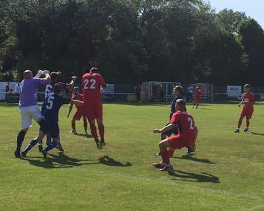 Tweedmouth keeper Walters punches clear as Kirkcaldy attack.
