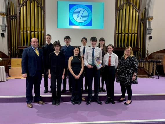 Competitors in the Young Musician final of Fife Festival of Music 2022, along with the Adjudicators: back row: Pawel Szulc – piano, Kinghorn; Connor Hill-Tibbs – harp, Kirkcaldy; Daniel Armstrong – ‘cello, Blebo Craigs; Tara McGhie – saxophone, Wormit.  front row: Stephen Cowan; Faith Mackenzie Page – clarsach, St Andrews; Lorelle Brodie –vocal, Kirkcaldy; Robbie Dowall – trombone, Dunfermline; Ruth Carson – percussion, Burntisland; Mae Murray.
