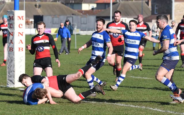 Howe fullback Gregor Smith dives over for the Cupar side's score (picture by Chris Reekie)