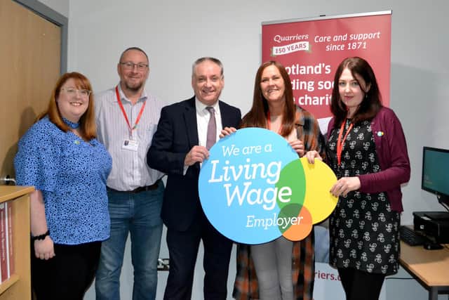 Richard Lochhead MSP at Quarriers Fife Supported Living Service in Cowdenbeath  with (from left) Rachel Morrison-McCormick, from Living Wage Scotland; Alistair Dickson, Quarriers Director of People and Technology; Fiona Edwards and Carrie McBain, team leaders