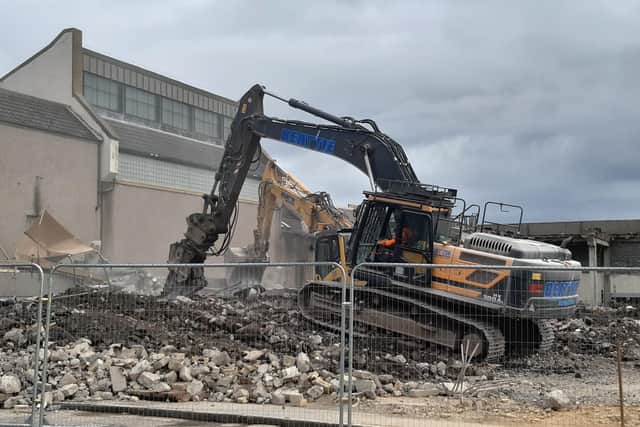 Demolition crews raze the former Tesco store as demolition work at the Postings continues