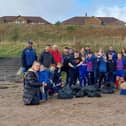 Members of the Wee Blues rugby team at the clean-up event last Sunday.