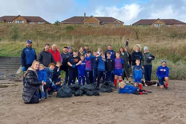 Members of the Wee Blues rugby team at the clean-up event last Sunday.