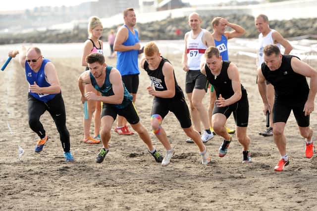 Runners take part in the 400m relay at the Beach Highland Games (Pic: Fife Photo Agency)
