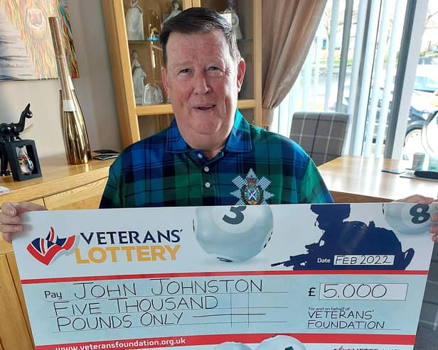 John Johnston with his lottery cheque