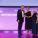 Heather Roberto receives her award from Grant Stott
