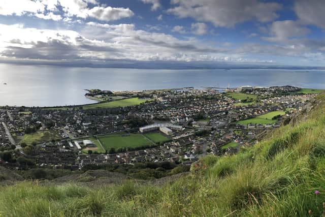 Ian Archibald, convener of Burntisland Heritage Trust and organiser of the annual summer exhibition, is pictured at The Binn viewfinder overlooking a spectacular view of Burntisland. Pic credit: Richard Preston