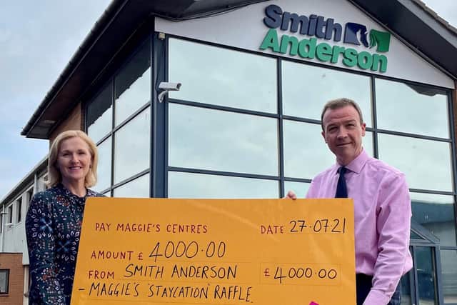 Olivia Slater, sales director, Smith Anderson (left) Michael Longstaffe, chief executive, with their match funding support for Maggie's Fife staycation raffle