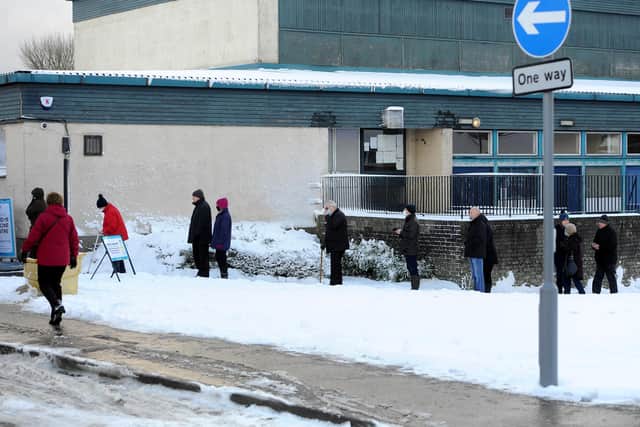 Locals queuing for their vaccine appointment at Templehall Community Centre today. Pic: Fife Photo Agency.