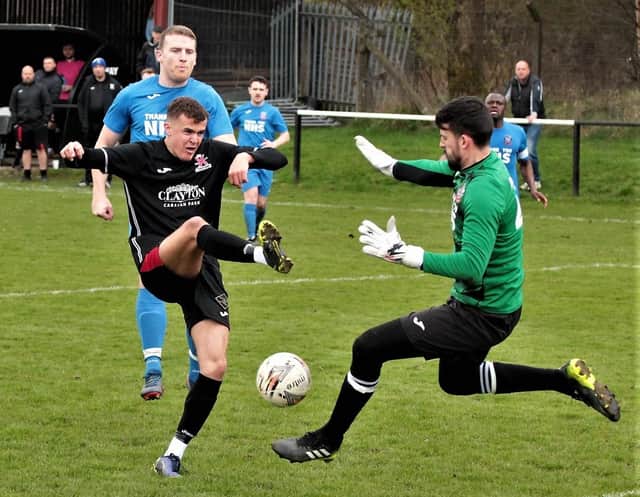 Lewis Sawers in the thick of the action for St Andrews. Pic by John Stevenson.