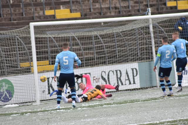 Kevin Smith is first to the ball from Ryan Wallace's free kick to score East Fife's winning goal (pictures by Kenny Mackay).